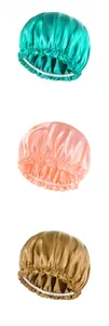 Detailed trio of satin hair bonnets in turquoise, light coral, and bronze gold finishes
