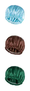 Detail of three satin sleep bonnets in blue, brown, and green with elastic ruffles