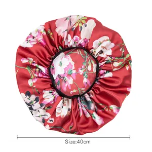 Adjustable satin sleep bonnet with red floral pattern and 40cm elastic headband