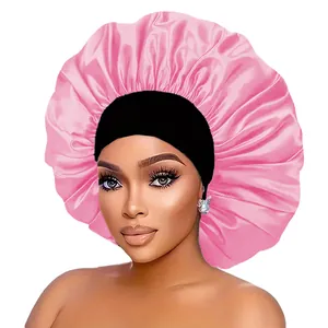 Front view of wide-band satin bonnet in pink and black for hair care and sleep