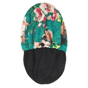 Detail of adjustable elastic strap and double-layered waterproof lining on floral shower cap