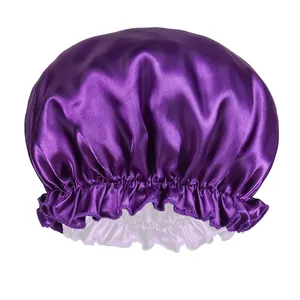 Close-up of a double-layered purple satin bonnet with elastic band and ruffled edges
