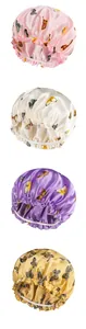 Detailed view of silky butterfly print sleep caps in pink, white, purple, and gold colors