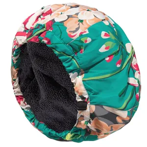 Detail of waterproof floral shower cap showing soft fleece lining and adjustable buckle