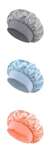 Detailed view of satin hair bonnets in grey, blue, and pink with elastic wide bands