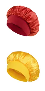 Detailed view of red and yellow satin sleep bonnets with wide elastic hair protection bands