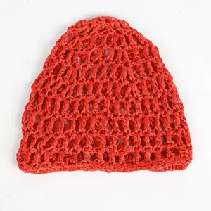Detail of red hollow knit mesh hat showing crochet texture and breathable grid pattern