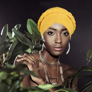 Bright yellow turban hat with braided design for women in bohemian ethnic fashion style