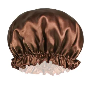 Detail of dark brown satin sleep cap showing elastic ruffled edge and silky texture