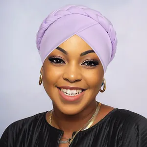 Detailed view of the braided lilac turban cap featuring front cross-pleat texture
