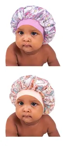 Detail of high-elasticity wide bands on satin baby sleep bonnets with unicorn patterns