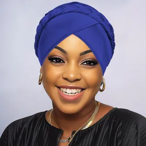 Close-up of royal blue turban headwrap featuring a stylish braided knot design