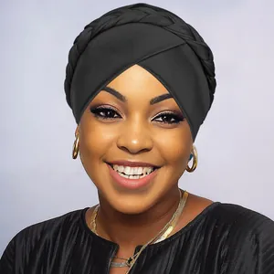 Detailed close-up of the braided edge and pleated texture on this black fashion turban hat