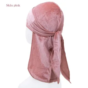 Detail view of skin pink velvet durag for children with long tail and smooth texture