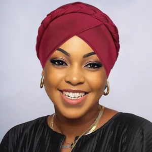 Detailed view of wine red braided turban hat showing premium fabric and cross-wrap design