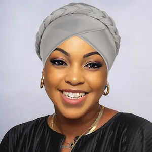 Close-up of the braided detail and soft textured knit fabric on this grey turban cap