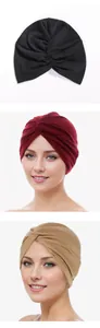 Detailed knit texture and twisted cross knot on colorful Muslim turban headscarf hats