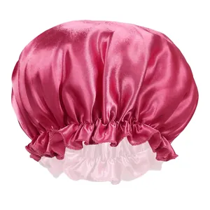 Detail of rose red satin sleep cap showing glossy fabric texture and elastic ruffle band