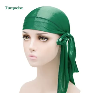 Silky satin durag in vibrant turquoise with long tail straps for hair compression
