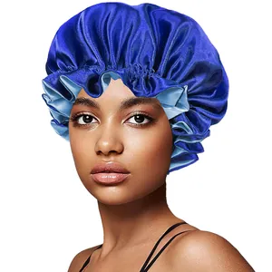 Close-up of dual-layer blue satin bonnet featuring ruffled elastic edge for hair care