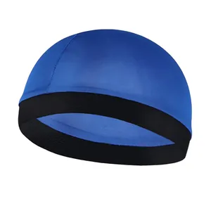 Detail of blue silk-like wave dome cap featuring breathable fabric and black elastic band
