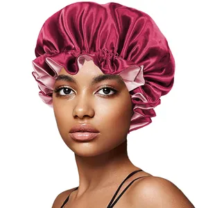 Close-up of dual-layer satin bonnet with elastic ruffled edge and smooth silk texture