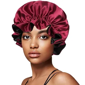 Detail of burgundy double-layered satin hair bonnet with elastic ruffled edges on model