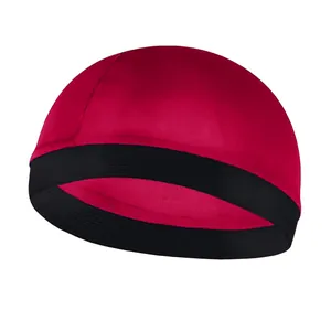 Detail of red faux silk wave dome cap featuring a durable black elastic wide headband