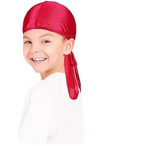 Detailed view of red silky durag for kids with long straps and shiny satin finish