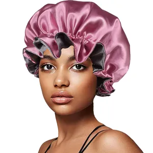 Detail of double-layer satin sleep cap with elastic ruffled edge in dusty rose and grey