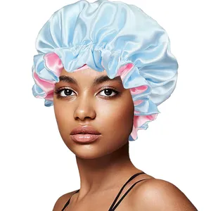 Detail of double-layer satin hair bonnet with elastic ruffle edge and silky blue texture