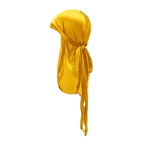 Detail of bright yellow silky satin durag showing smooth texture and long tail straps