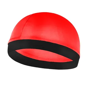 Close-up of vibrant red wave dome cap featuring a wide black elastic band and stitching
