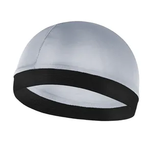 Close-up of breathable silver fabric texture and black elastic band on the dome cap