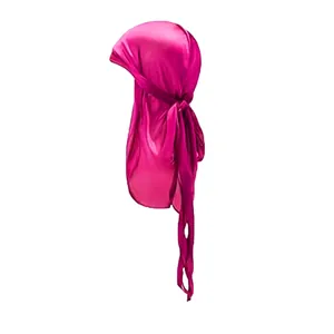 Detail of bright pink silky durag headwrap featuring long straps and smooth satin texture