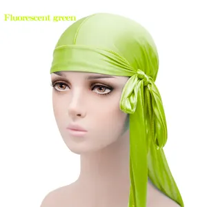 Fluorescent green silky satin durag headwrap with long tail on mannequin head