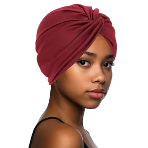 Close-up of a burgundy twisted knot turban hat made of premium elastic knit fabric