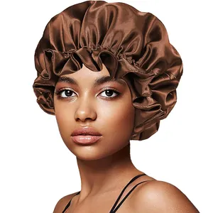 Detailed close-up of brown satin sleep bonnet showing elastic ruched trim and silky texture