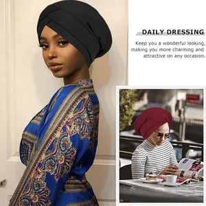 Women's ribbed knit turban hat featuring a cross-wrap design in black and burgundy