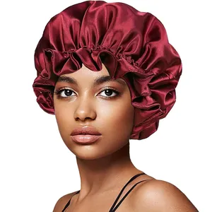 Close-up of wine red satin sleep bonnet featuring a wide elastic band on a model