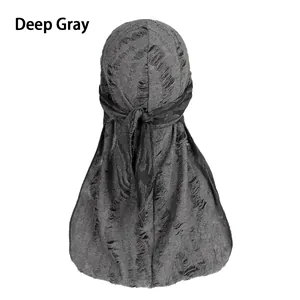 Detail eines dunkelgrauen Durags mit Vintage-Struktur und rückseitigem Bindeband