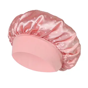 Pink satin hair bonnet with rhinestones and a wide elastic band for comfortable hair care