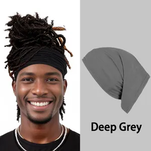 Detail view of deep grey elastic multipurpose headwear with model styling reference