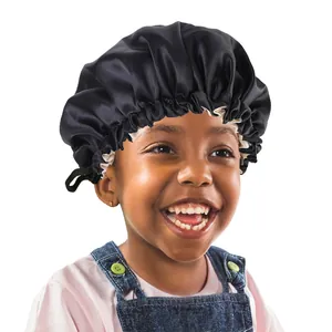 Detail of children's black satin sleep bonnet with adjustable button and striped edge