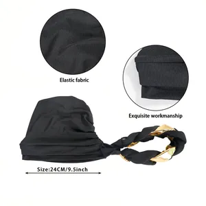 Elastic black ribbed turban hat with gold braided chain decoration and 24cm width detail