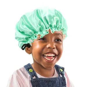Close-up of mint green satin hair bonnet with an adjustable drawstring for kids