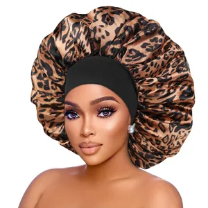 Detail of large satin bonnet featuring leopard print and black wide elastic headband