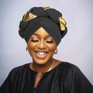 Detail of cross-braided black knit and metallic gold fabric on stylish turban cap