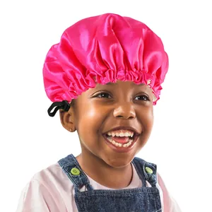 Detail view of rose pink satin bonnet for kids featuring an adjustable black buckle