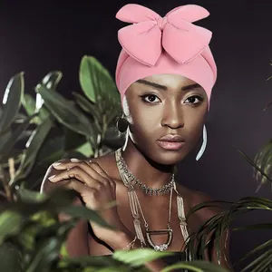 Vibrant pink bow turban headwear for women featuring a stylish ethnic knot design